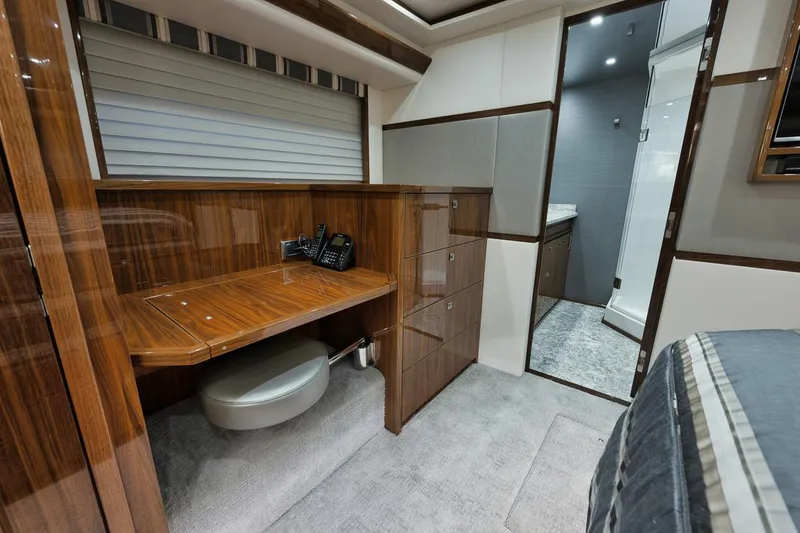 Slide: The Image of Luxurious interior of 2019 Viking 80 Convertible yacht with wood finishes and modern amenities. - 36