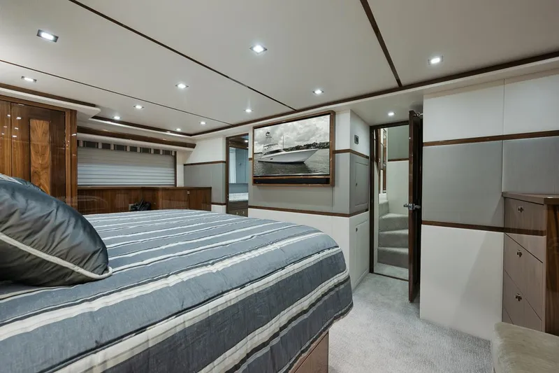 Slide: The Image of Luxurious bedroom interior of 2019 Viking 80 Convertible yacht with modern design. - 37