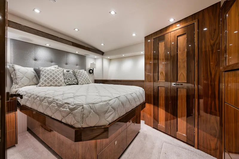 Slide: The Image of Luxurious bedroom interior of 2019 Viking 80 Convertible yacht with elegant wood finishes. - 46