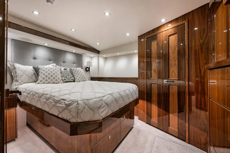 Slide: The Image of Luxurious bedroom interior of 2019 Viking 80 Convertible yacht with elegant wood finishes. - 47