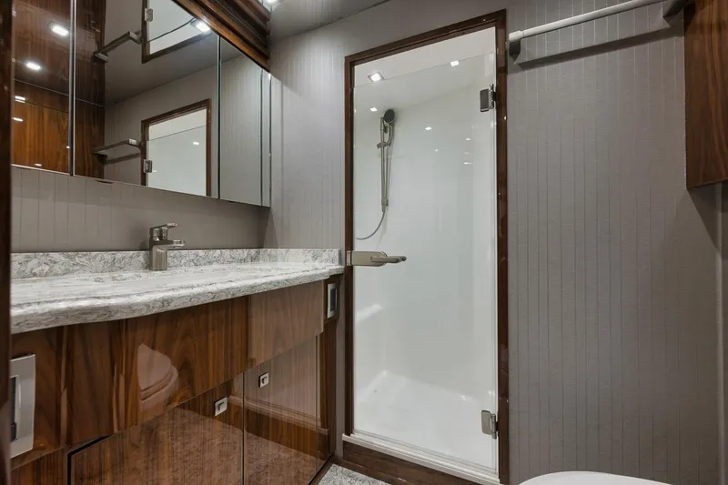 Slide: The Image of Luxurious bathroom in 2019 Viking 80 Convertible yacht with modern fixtures and shower. - 49