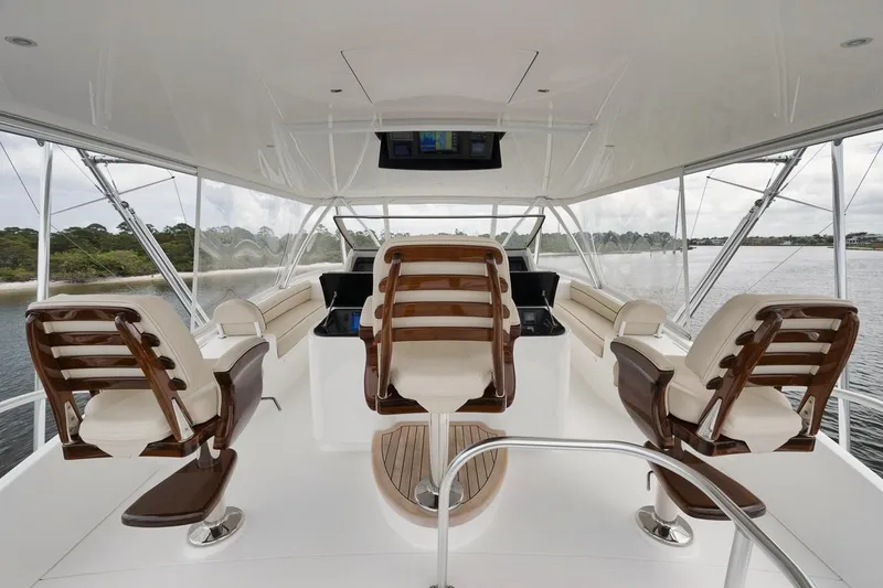 Slide: The Image of Luxurious 2019 Viking 80 Convertible yacht interior with elegant seating and panoramic views. - 53
