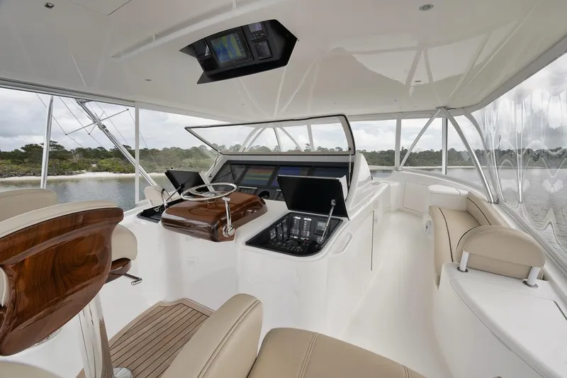 Slide: The Image of Luxurious interior of 2019 Viking 80 Convertible yacht with modern helm and seating. - 57