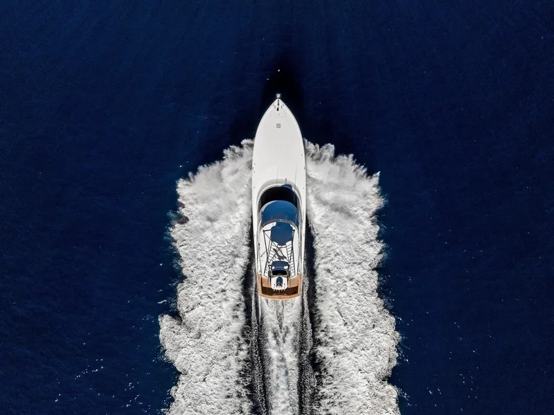 Slide: The Image of Aerial view of 2019 Viking 80 Convertible yacht cruising on open water. - 6