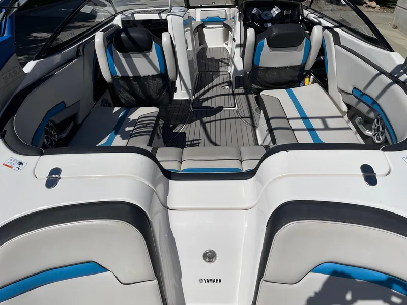 Slide: The Image of 2018 Yamaha Boats 242X E-Series interior with sleek seating and modern design. - 4