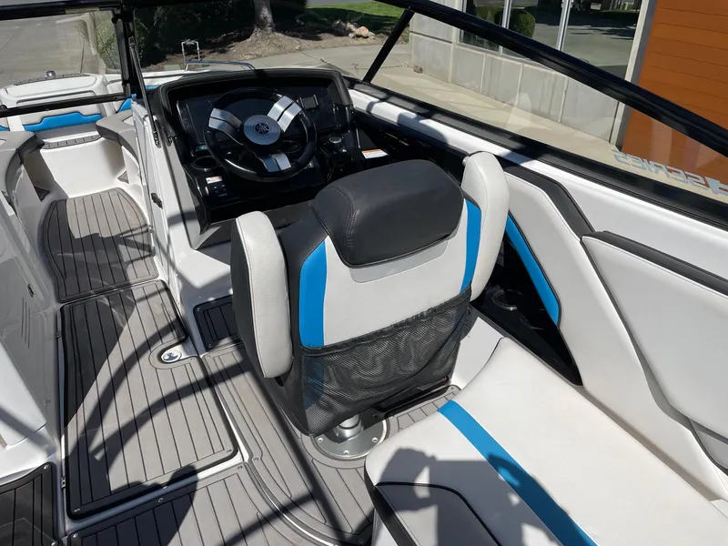 Slide: The Image of 2018 Yamaha Boats 242X E-Series interior with steering wheel and seating. - 5