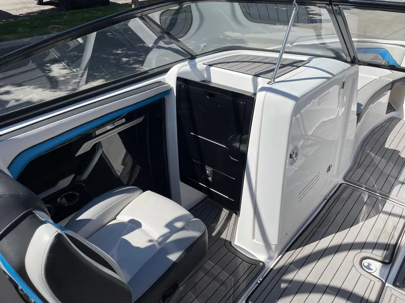 Slide: The Image of 2018 Yamaha Boats 242X E-Series interior with sleek seating and modern dashboard design. - 9