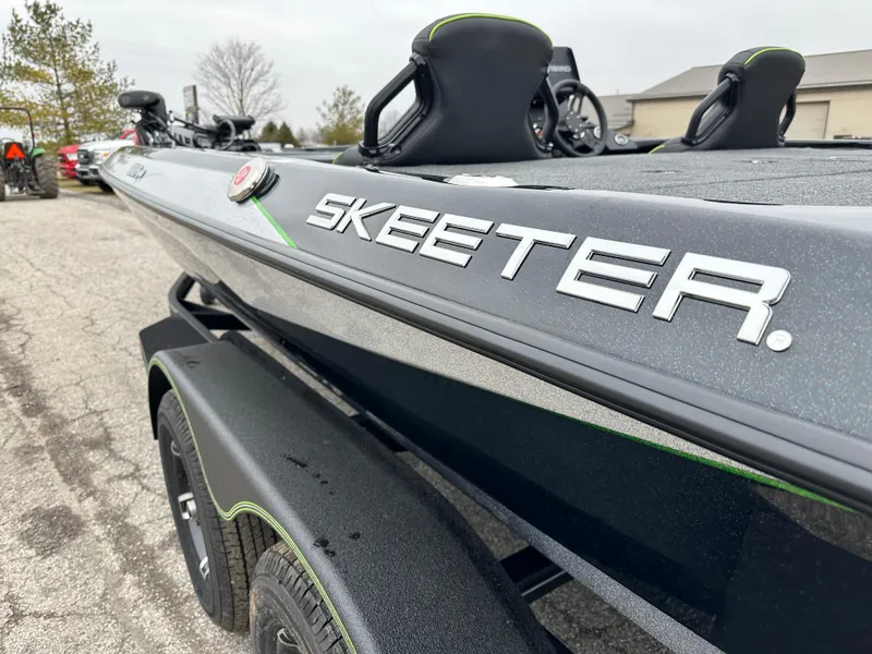 Slide: The Image of 2024 Skeeter ZXR19 boat on trailer, showcasing sleek design and branding. - 10