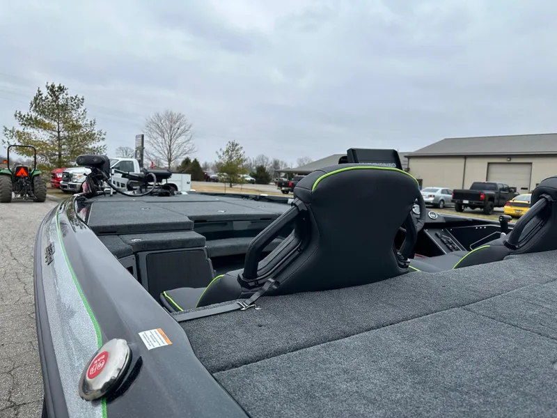 Slide: The Image of 2024 Skeeter ZXR19 boat with sleek seating and modern design in a parking area. - 11