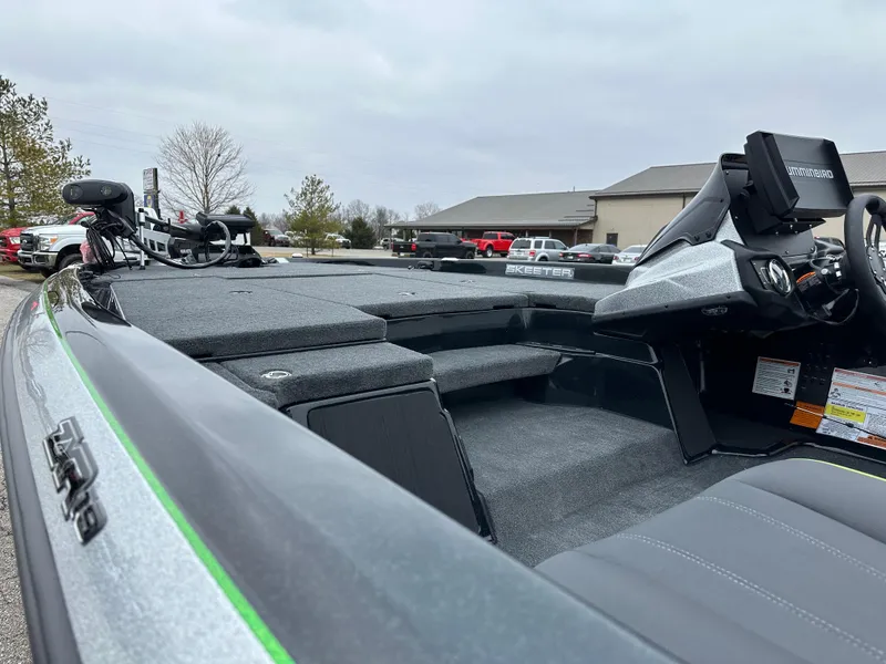 Slide: The Image of 2024 Skeeter ZXR19 boat interior with modern dashboard and seating. - 13