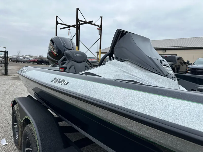 Slide: The Image of 2024 Skeeter ZXR19 boat with sleek design and powerful engine, parked outdoors. - 18