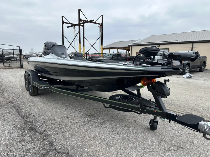 Slide: The Image of 2024 Skeeter ZXR19 fishing boat on trailer in parking lot. - 4