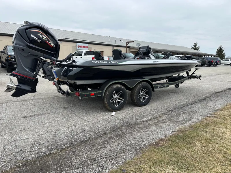 Slide: The Image of 2024 Skeeter ZXR19 boat with Yamaha engine on a trailer in a parking lot. - 6