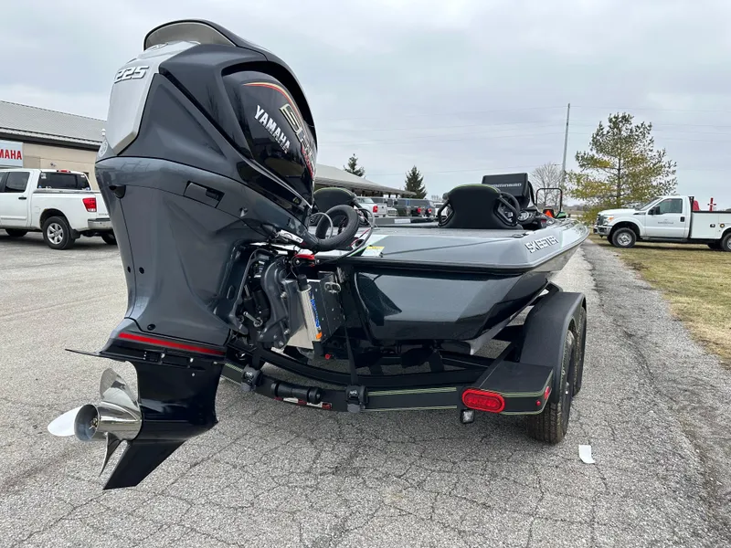Slide: The Image of 2024 Skeeter ZXR19 boat with Yamaha engine, parked on a trailer in a lot. - 7