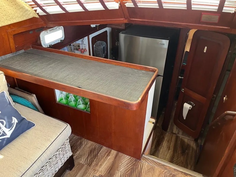 Slide: The Image of Interior of 1980 Gulfstar Trawler with wood finish and modern appliances. - 11