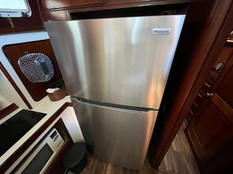 Slide: The Image of Stainless steel refrigerator in 1980 Gulfstar Trawler kitchen interior. - 20