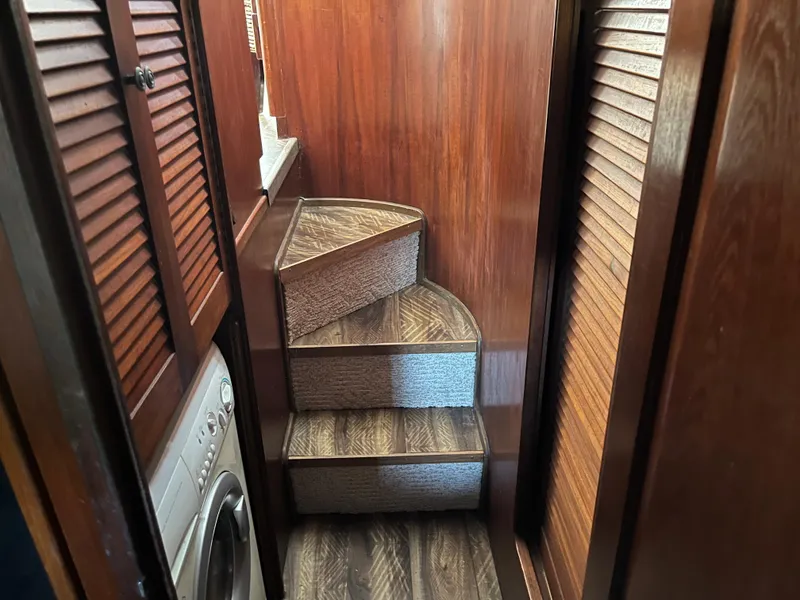 Slide: The Image of Interior of 1980 Gulfstar Trawler with wooden stairs and built-in washer. - 36