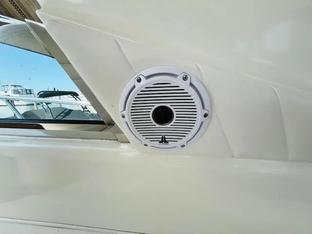 Slide: The Image of 1999 Sea Ray 400 Sundancer boat speaker detail with nearby yachts in background. - 14