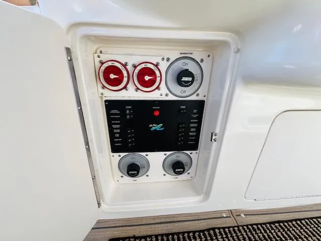 Slide: The Image of Control panel on a 1999 Sea Ray 400 Sundancer yacht. - 15