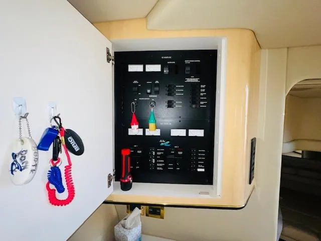 Slide: The Image of Electrical panel inside a 1999 Sea Ray 400 Sundancer yacht cabin. - 24
