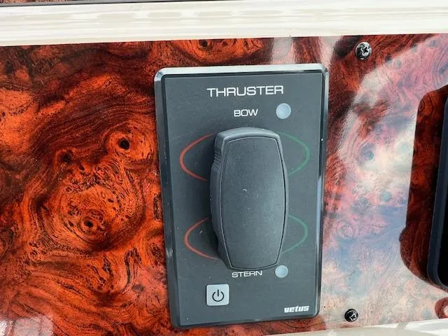 Slide: The Image of Control panel of a 1999 Sea Ray 400 Sundancer boat with thruster controls. - 8