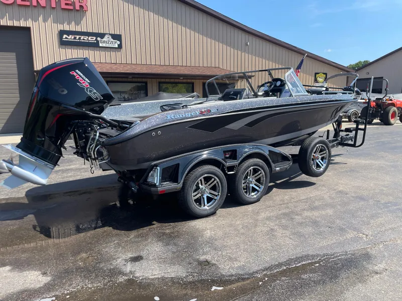 Slide: The Image of 2025 Ranger 620FS Ranger Cup Equipped boat on trailer, parked outdoors. - 1