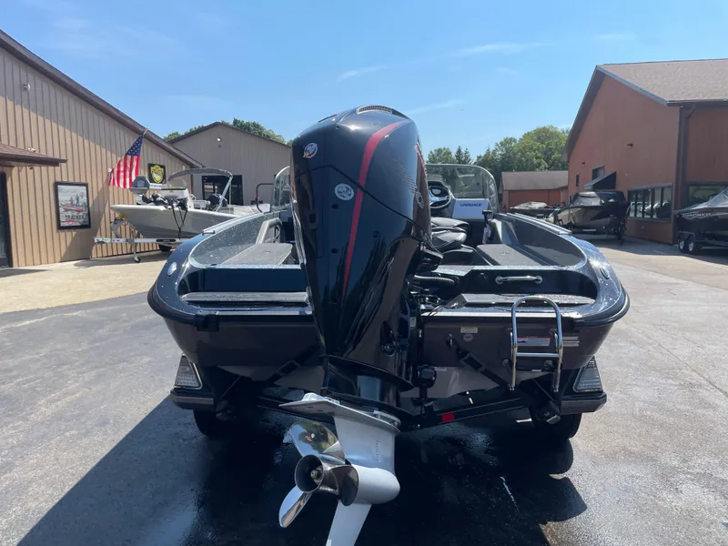 Slide: The Image of 2025 Ranger 620FS Ranger Cup Equipped boat, rear view, parked outdoors on a sunny day. - 2