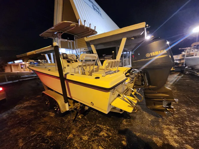 Slide: The Image of 2005 Sea Hunt Navigator 22 boat with Yamaha outboard motor, parked at night. - 5