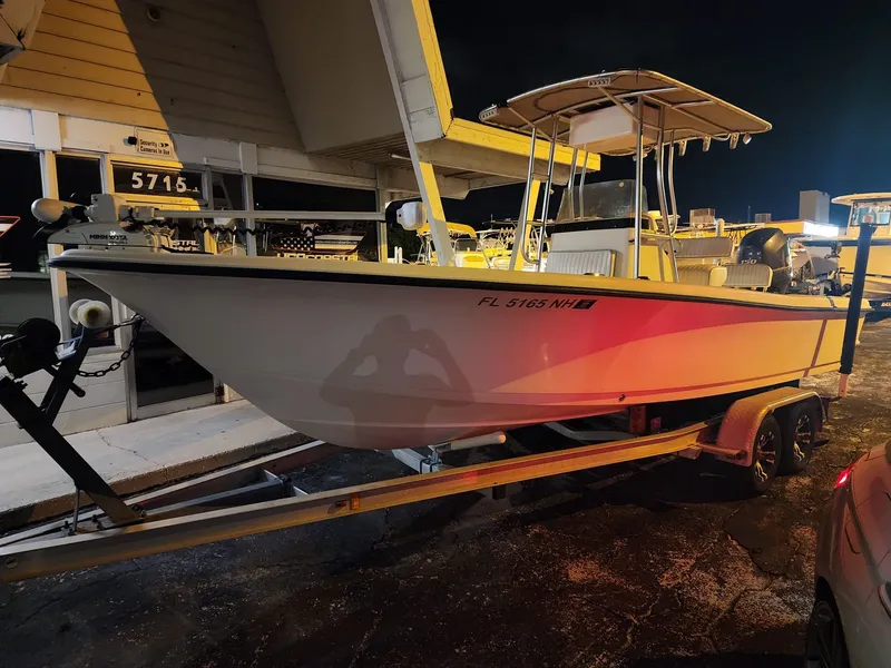 Slide: The Image of 2005 Sea Hunt Navigator 22 boat on trailer, parked at night. - 7