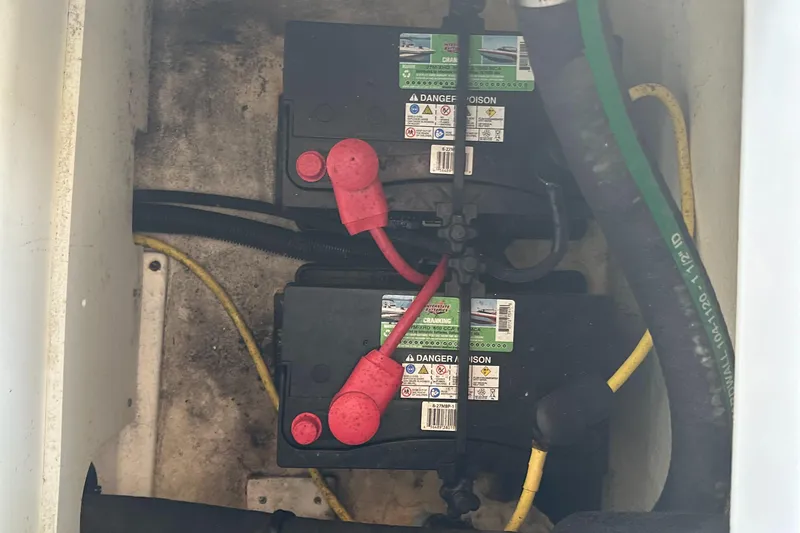Slide: The Image of Batteries in a 2022 Chaparral 267 SSX OB boat compartment. - 14