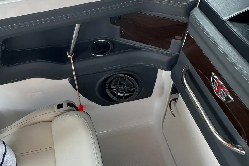 Slide: The Image of 2022 Chaparral 267 SSX OB interior with speaker and seating detail. - 32