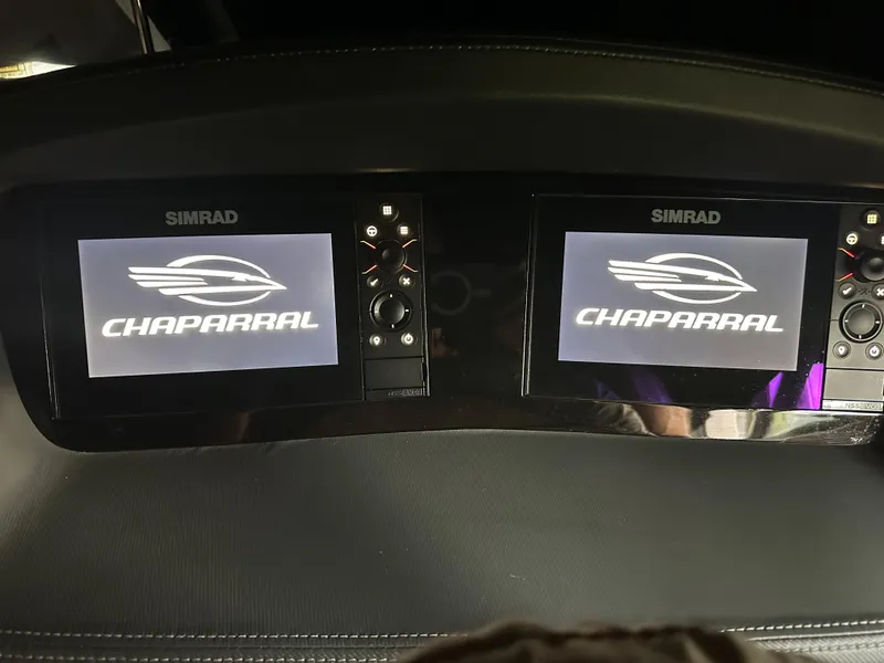 Slide: The Image of Simrad displays on 2022 Chaparral 267 SSX OB boat dashboard. - 4