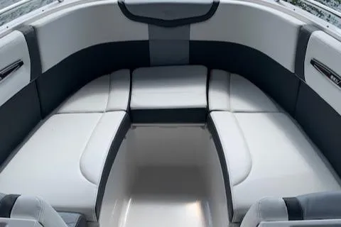 Slide: The Image of 2022 Chaparral 267 SSX OB boat interior with sleek white and gray seating. - 8