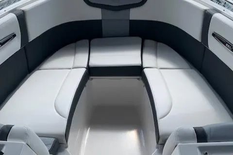 Slide: The Image of 2022 Chaparral 267 SSX OB boat interior with white and gray seating. - 9
