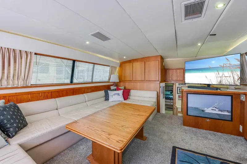 Slide: The Image of Luxurious interior of 1990 Bertram 50 Convertible yacht with spacious seating and modern amenities. - 12