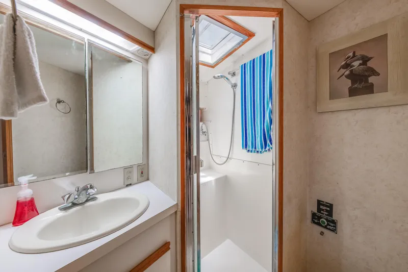 Slide: The Image of Bathroom interior of 1990 Bertram 50 Convertible yacht with shower and sink. - 22