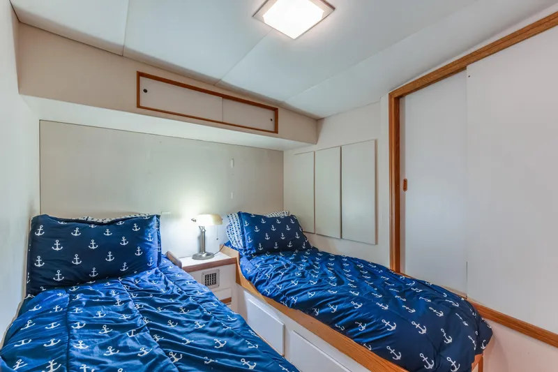 Slide: The Image of Cozy twin cabin with nautical bedding on 1990 Bertram 50 Convertible yacht. - 23