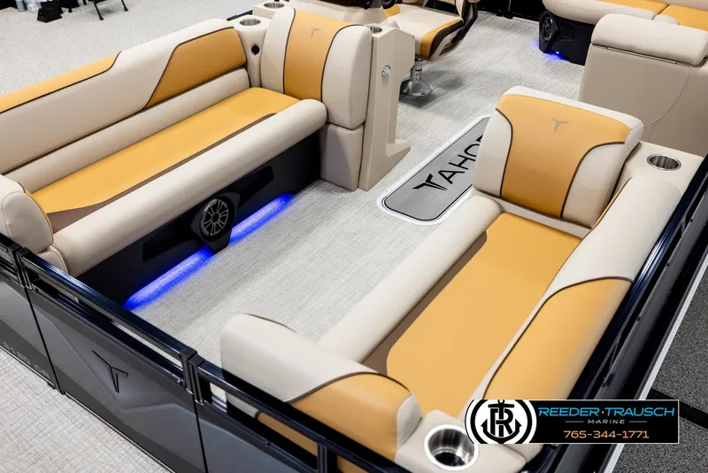 Slide: The Image of Luxurious 2025 Tahoe SP Cr boat interior with beige and orange seating, blue LED lighting. - 10