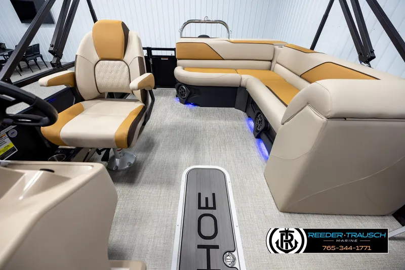 Slide: The Image of Interior of 2025 Tahoe SP Cr boat with beige and tan seating, blue LED lights. - 14