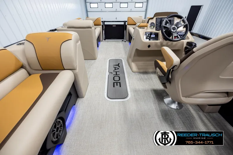 Slide: The Image of Interior of 2025 Tahoe SP Cr boat with beige and tan seating, modern dashboard. - 17