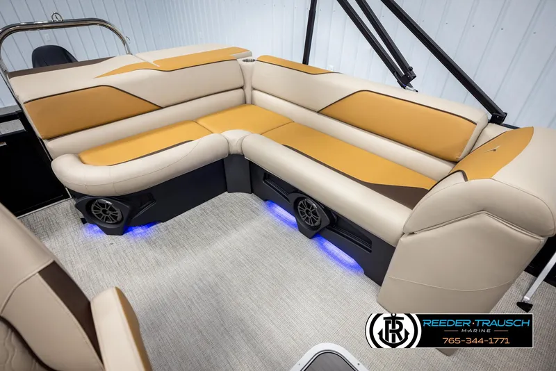 Slide: The Image of Luxurious 2025 Tahoe SP Cr boat interior with beige and tan seating, featuring blue LED lighting. - 20
