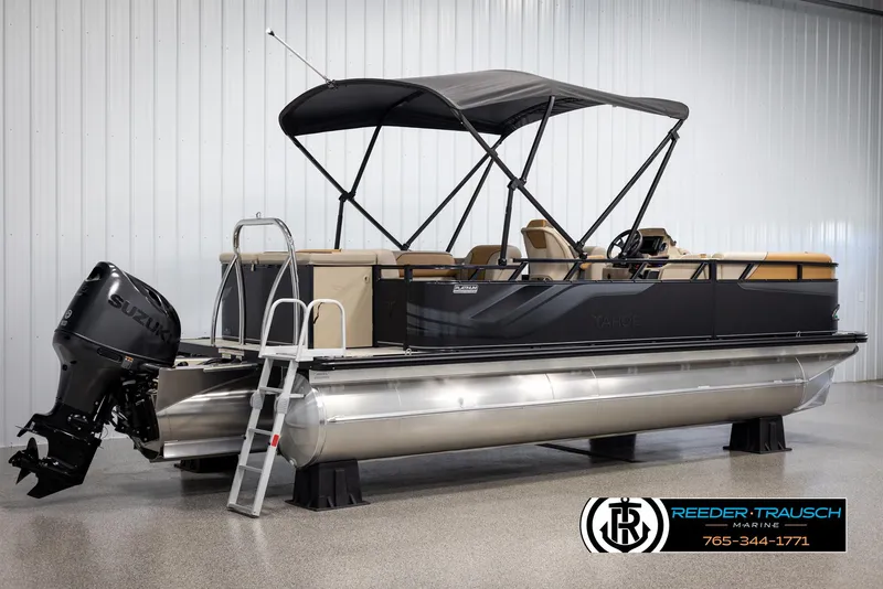 Slide: The Image of 2025 Tahoe SP Cr pontoon boat with Suzuki outboard motor in showroom. - 6