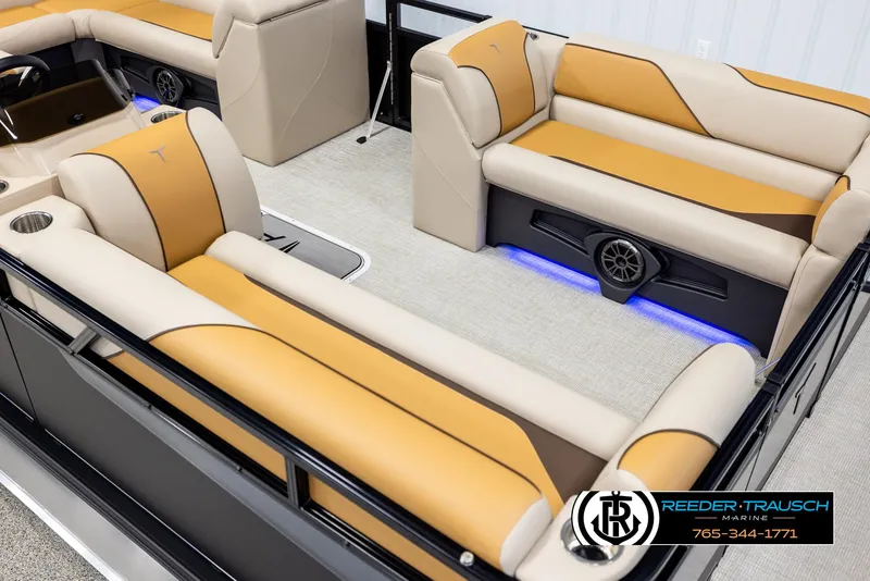 Slide: The Image of Luxurious 2025 Tahoe SP Cr boat interior with beige and orange seating, blue LED lighting. - 9