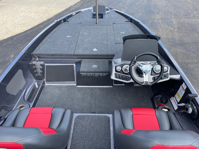 Slide: The Image of 2025 Ranger Z185 boat interior with red and black seats, modern dashboard, and spacious deck. - 5
