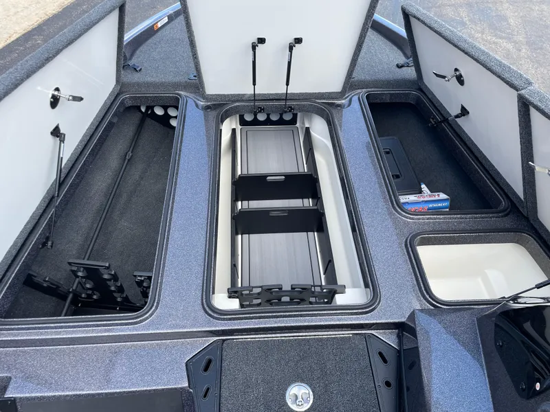 Slide: The Image of 2025 Ranger Z185 boat storage compartments with open lids, showcasing organized interior space. - 9