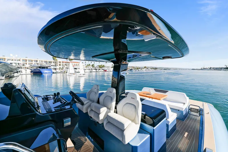 Slide: The Image of 2023 Solaris Power 40 Open yacht with luxurious seating and sleek design on the water. - 12