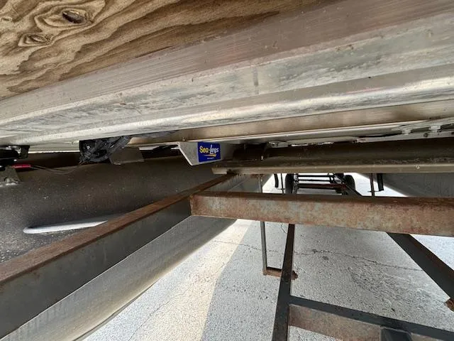 Slide: The Image of Underneath view of 2012 SunChaser 8522 C-N-F pontoon boat on trailer. - 11