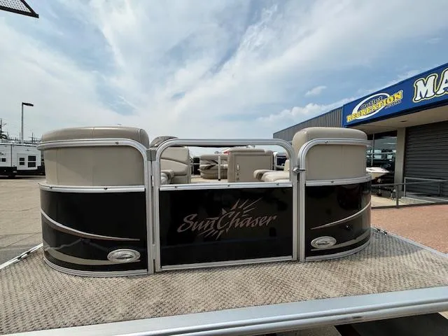 Slide: The Image of 2012 SunChaser 8522 C-N-F pontoon boat at marina dealership. - 12