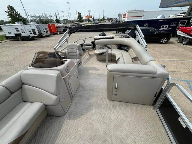 Slide: The Image of 2012 SunChaser 8522 C-N-F pontoon boat with spacious seating in a parking lot. - 17