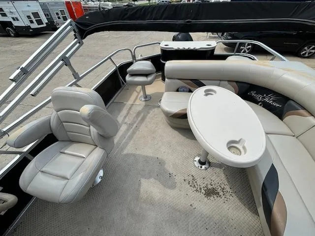 Slide: The Image of 2012 SunChaser 8522 C-N-F pontoon boat interior with seating and table. - 19